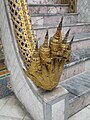 A naga at the steps of a building in the Wat Phra Kaew in Bangkok