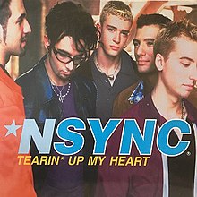 The NSYNC members are seen crowded near each other while facing different directions