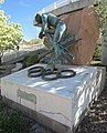 Sculpture on the University of Utah campus with rock in background, April 2021