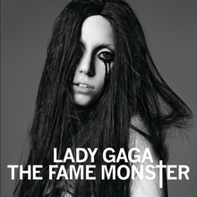 Black-and-white image of Lady Gaga with black, disheveled hair, and black liner around her eyes, dripping down her cheeks.