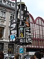 Sticker art in a traffic light in Antwerp.